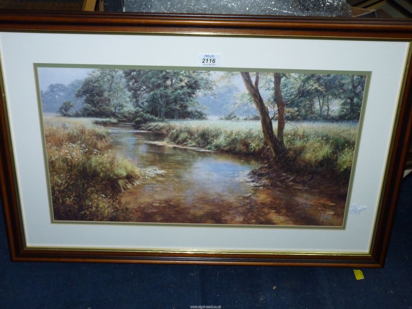 A framed and mounted Print depicting a country river landscape, signed lower right Dipnall,