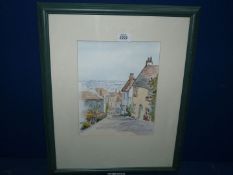 A framed Watercolour depicting Church Street by Norene Stewart.