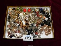 A quantity of clip on and pierced earrings; tortoiseshell, enamel, multi stone,