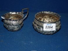 A small Silver cream jug and sugar bowl, London 1892, makers Josiah Williams & Co., 127 gms.