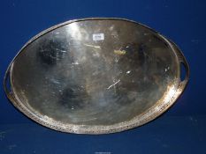 A large silver plated galleried tray having two handles, 24 1/2" long x 16" wide x 2" deep.