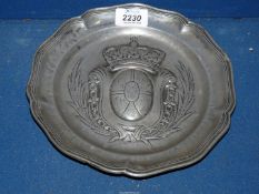 A Pewter display plate with central Coat of Arms design, 8 3/4'' diameter.