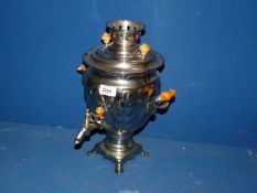 An electric Samovar with wooden handles and finials.