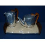 A part Piquot ware Teaset of teapot, hot water jug and tray.