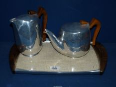 A part Piquot ware Teaset of teapot, hot water jug and tray.