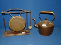 A Brass table Gong and a Copper kettle.