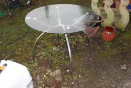 A glass topped table, 35 1/2" wide x 30" high.