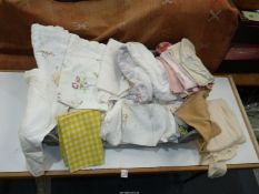 A quantity of linen to include; tablecloths, napkins, cotton, embroidery, etc.