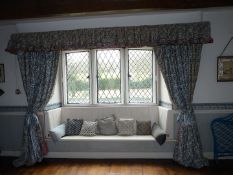 Two pairs of interlined curtains having two shades of blue ribbon pattern on a cream ground with
