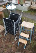 Folding kitchen stools/steps, and a shopper on wheels.