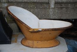 An enamelled metal Victorian Slipper bath, 43" long x 32" wide x 24'' high.