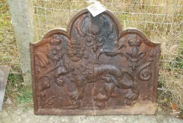 A cast iron fire back, 31" wide x 28" high (cracked).