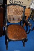 A bentwood Rocking chair with cane back.