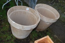 Two very large clay pots, 2' wide x 21" high.