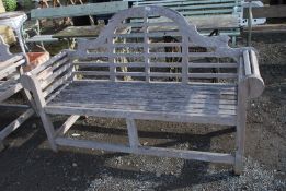 A Lutyens design Teak garden seat, 65 1/2" wide x 41" high.