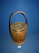 A vintage oriental bamboo wedding Basket, 18" tall.