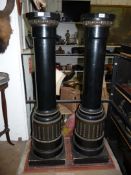 An elegant pair of Ebonised turned wood Pedestals having square bases and octagonal tops with egg