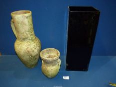 A terracotta Ewer, 15'' tall (crack to rim), stoneware Urn, 7'' tall and black glass Vase,