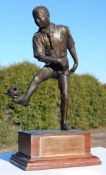 A finely detailed Bronze figure of Scout kicking football, presented to Sir Charles Innes,