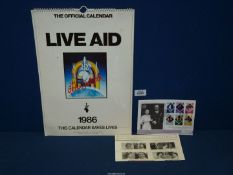 An original Live Aid calendar together with a quantity of commemorative stamps.