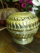 A large brass incense holder, top finial missing, 10" diameter x 9 1/2" tall.
