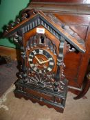 A large antique two train spring driven movement Cuckoo/Bracket Clock of pine and other stained and