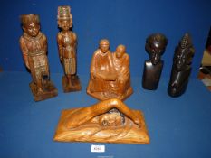Six hand carved figures to include; a pair of African ebony Masai figures,