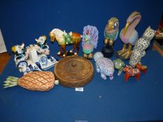 A quantity of brightly coloured wooden figures, a china figure of Tang Dynasty style horse,