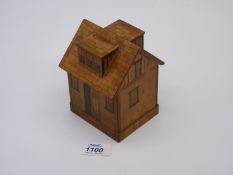 A collectible 19th century 19th century money box in the form of a house;