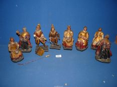 Eight early wired braced, wood, leather/papier mache Figures; two of warriors with plumbed helmets,
