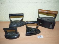 A group of four Irons including 'Main' No. 400 Gas Iron with a wooden handle, Hawkins & Co.