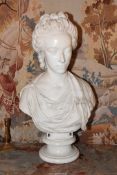 A large sculpted Bust of a Lady with plaits and ringlets and wearing a wrap/scarf, 27 1/4'' high,