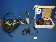 Two pairs of David Clark Company Inc aviator's communication Headsets with boom microphones,