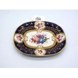 An early 19th Century Coalport porcelain teapot stand painted in cobalt blue with reserves of pink