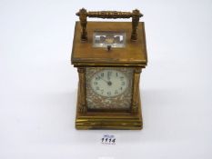A late 19th century French brass cased repeating carriage clock with twin train movement striking