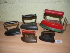 A group of five Irons including an early electric iron 'British Made & Guaranteed,