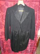 A Gieves Ltd. black tailcoat, some holes, 40" chest approx. size M.