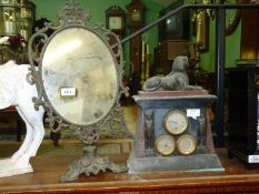 An oval Dressing Mirror in ornate brass frame and stand,