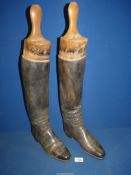 A pair of Gents Black knee high Riding boots, length of sole 10 1/4" having wooden trees.