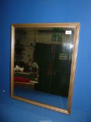 A gilt framed, bevelled glass Wall Mirror, 21 1/4'' wide x 26'' tall.