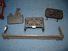 Two cast iron Trivet stands, one having paw feet, cast metal fire surround etc.