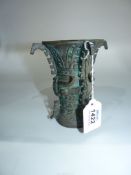 A copper Zun type wine Vessel having a wide flared mouth with fretwork to the sides,