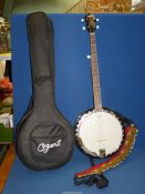 An Ozark Banjo with battery operated tuner and carrying case.