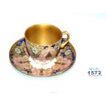 A highly decorative 1920s porcelain cup and saucer in the sevres style marked for William Rouse.