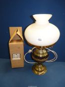 A brass Oil Lamp with opaque glass shade converted to electric but with a wick fitting for