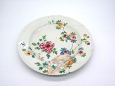 A Qianlong period famille rose Charger finely painted with flowers damaged and repaired,