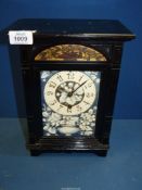 A rare late 19th century Aesthetic period mantel Clock in black lacquer having a painted face with