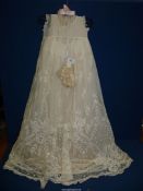 A very old and long embroidered lace Christening gown and bonnet, complete with cotton petticoat,