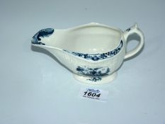 A Worcester sauce boat painted in blue with the Billboard and Island pattern.