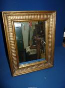 A gilt framed freestanding Mirror, 19" x 15".